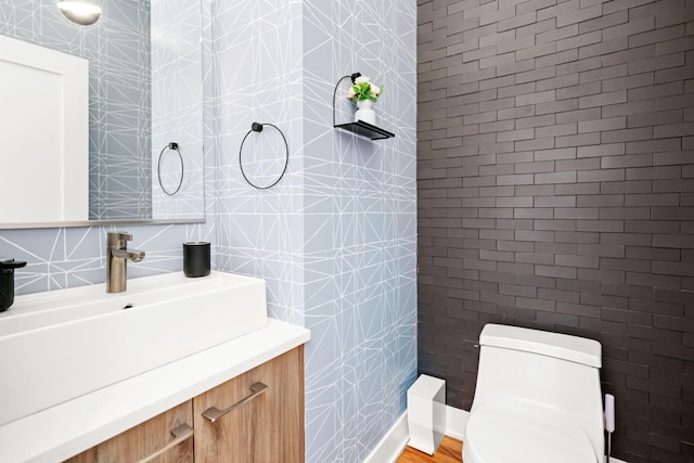 2113 N Clark St, Chicago, IL 60614 - half bath featuring tile walls, toilet, and vanity