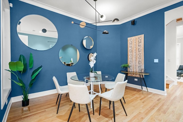 2113 N Clark St, Chicago, IL 60614 - dining space with ornamental molding, wood finished floors, and baseboards