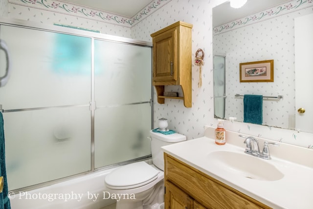 527 Edwin Dr, Bourbonnais, IL 60914 - bathroom with wallpapered walls, vanity, and combined bath / shower with glass door