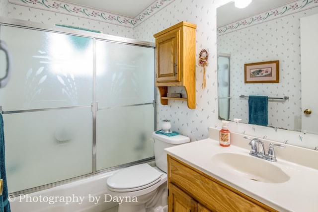 527 Edwin Dr, Bourbonnais, IL 60914 - bathroom with wallpapered walls, vanity, and enclosed tub / shower combo