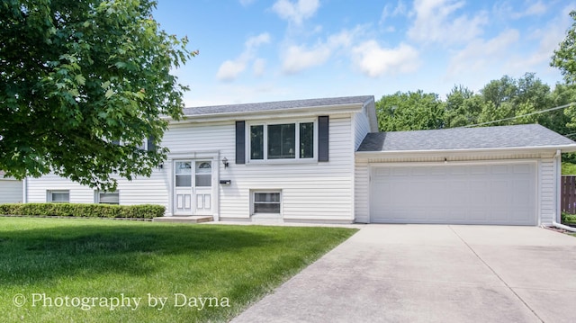 527 Edwin Dr, Bourbonnais, IL 60914 - split foyer home featuring driveway, a front yard, an attached garage, and a shingled roof