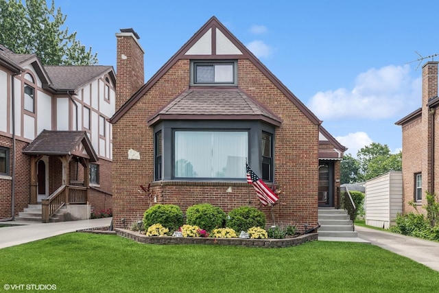 7229 W Lunt Ave, Chicago, IL 60631 - tudor home with brick siding and a front lawn