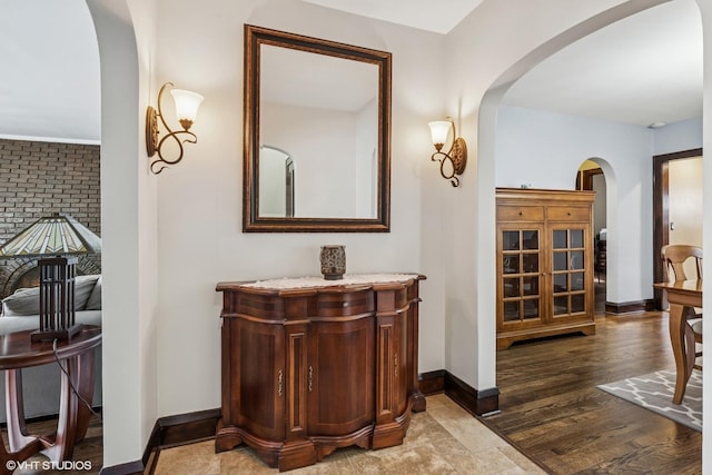 7229 W Lunt Ave, Chicago, IL 60631 - hallway featuring arched walkways and wood finished floors