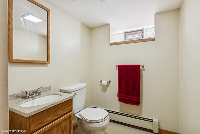 7229 W Lunt Ave, Chicago, IL 60631 - bathroom featuring baseboard heating and vanity