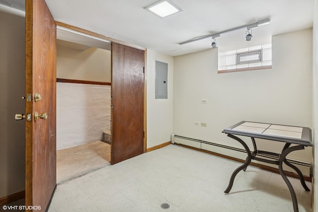 7229 W Lunt Ave, Chicago, IL 60631 - basement featuring electric panel, rail lighting, baseboard heating, and tile patterned floors