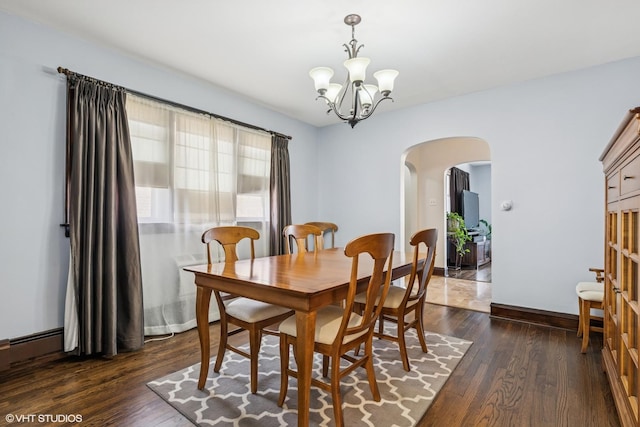 7229 W Lunt Ave, Chicago, IL 60631 - dining space with arched walkways, a chandelier, and dark wood finished floors