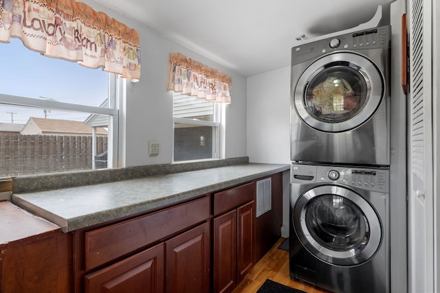 1811 Dearborn St, Crest Hill, IL 60403 - laundry room featuring estacked washer and dryer and light wood-style floors