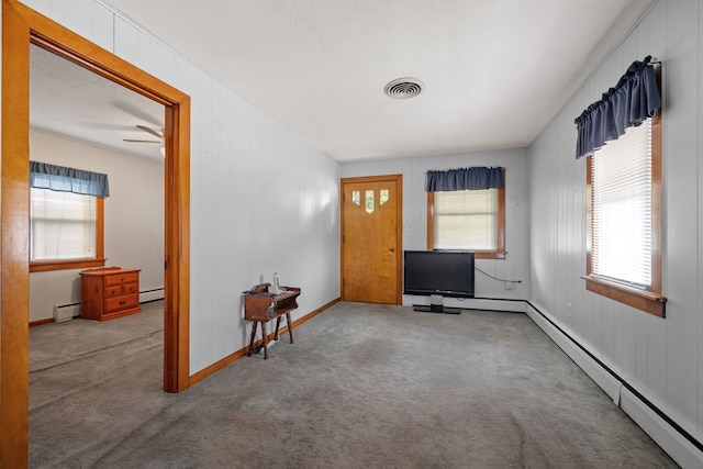 1811 Dearborn St, Crest Hill, IL 60403 - carpeted entryway with a baseboard heating unit, a baseboard radiator, and healthy amount of natural light