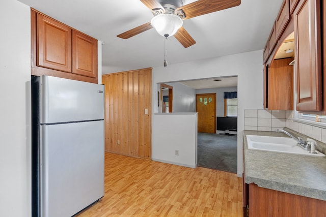 1811 Dearborn St, Crest Hill, IL 60403 - kitchen featuring freestanding refrigerator, ceiling fan, brown cabinetry, light wood-style flooring, and healthy amount of natural light