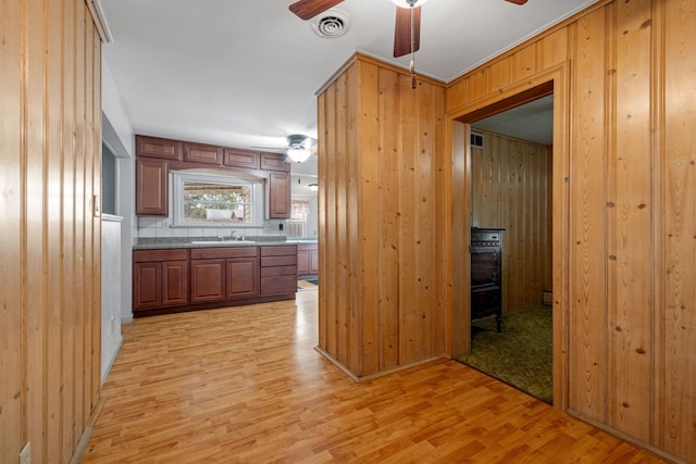 1811 Dearborn St, Crest Hill, IL 60403 - kitchen with a ceiling fan, light wood-type flooring, and wood walls