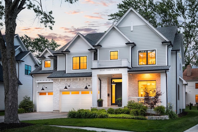 834 Wellner Rd, Naperville, IL 60540 - view of front facade featuring driveway, a shingled roof, a garage, and a front yard