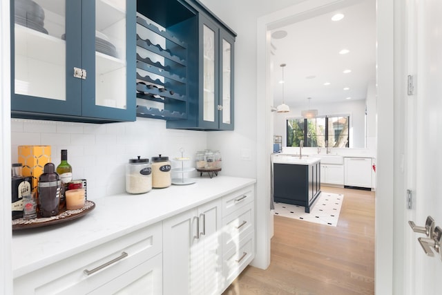 834 Wellner Rd, Naperville, IL 60540 - bar area featuring dishwasher, light wood-style floors, backsplash, recessed lighting, and decorative light fixtures