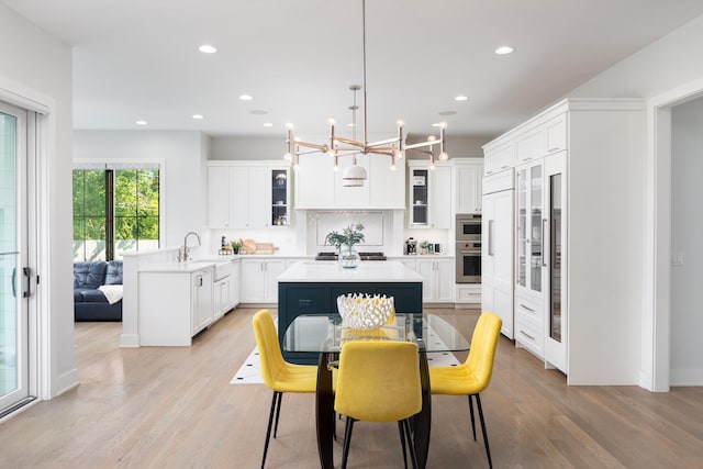 834 Wellner Rd, Naperville, IL 60540 - dining room with light wood-type flooring, a chandelier, and recessed lighting