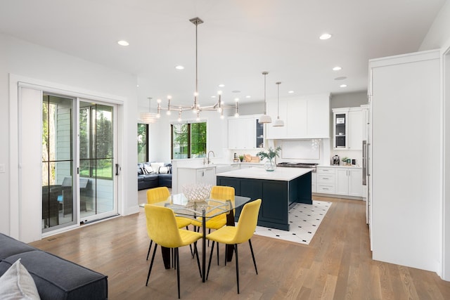 834 Wellner Rd, Naperville, IL 60540 - dining space featuring light wood-style floors and recessed lighting