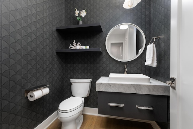 834 Wellner Rd, Naperville, IL 60540 - half bath featuring wood finished floors, vanity, and wallpapered walls