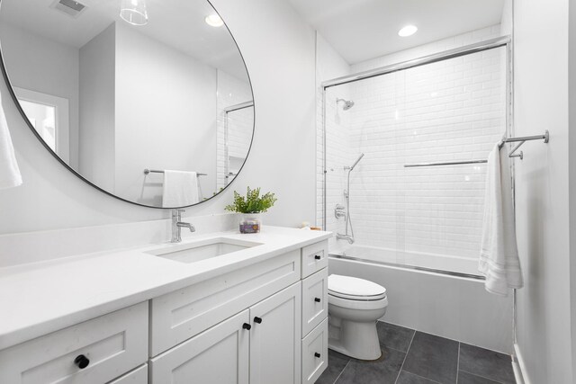 834 Wellner Rd, Naperville, IL 60540 - bathroom featuring vanity, shower / bath combination with glass door, tile patterned flooring, and recessed lighting