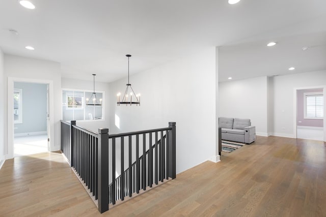 834 Wellner Rd, Naperville, IL 60540 - corridor featuring a chandelier, an upstairs landing, light wood finished floors, and recessed lighting