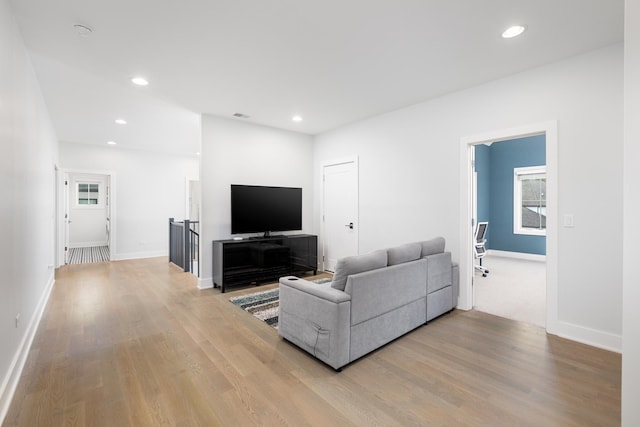 834 Wellner Rd, Naperville, IL 60540 - living area with light wood-style floors and recessed lighting