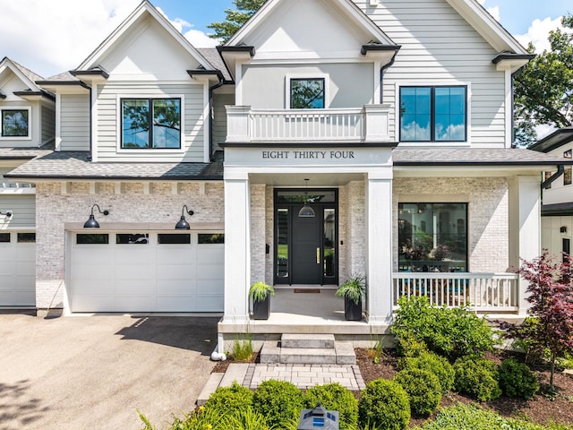 834 Wellner Rd, Naperville, IL 60540 - view of front facade featuring asphalt driveway, an attached garage, brick siding, and a shingled roof