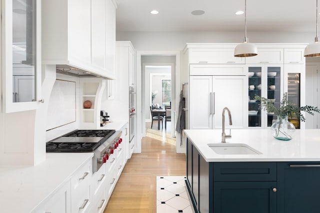 834 Wellner Rd, Naperville, IL 60540 - kitchen with stainless steel gas cooktop, light countertops, white cabinets, recessed lighting, and pendant lighting