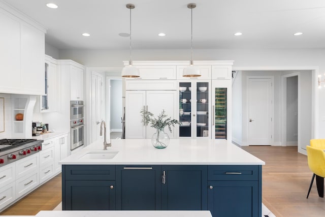 834 Wellner Rd, Naperville, IL 60540 - kitchen featuring white cabinets, appliances with stainless steel finishes, hanging light fixtures, light countertops, and recessed lighting