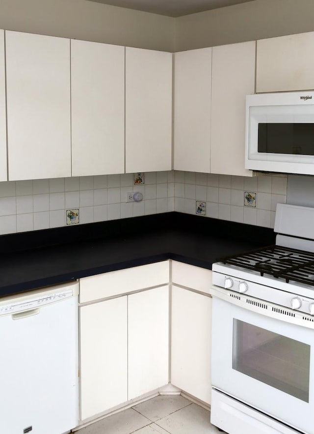 402 Catbird Ln, Deerfield, IL 60015 - kitchen with white appliances, backsplash, white cabinetry, and dark countertops