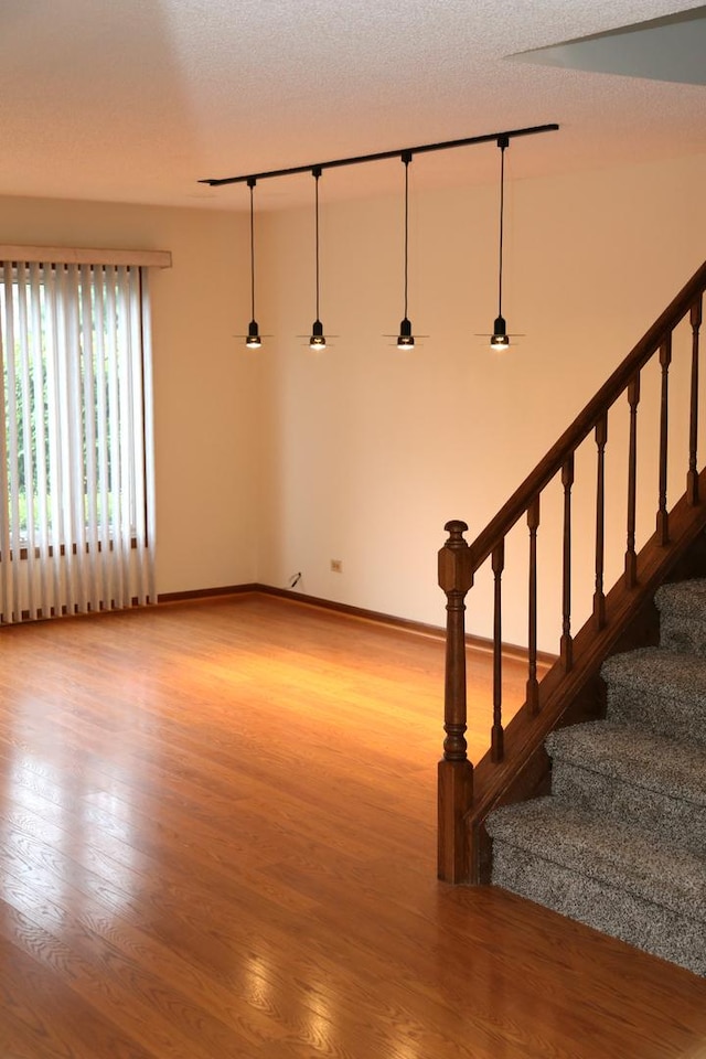 402 Catbird Ln, Deerfield, IL 60015 - spare room with wood finished floors and stairway