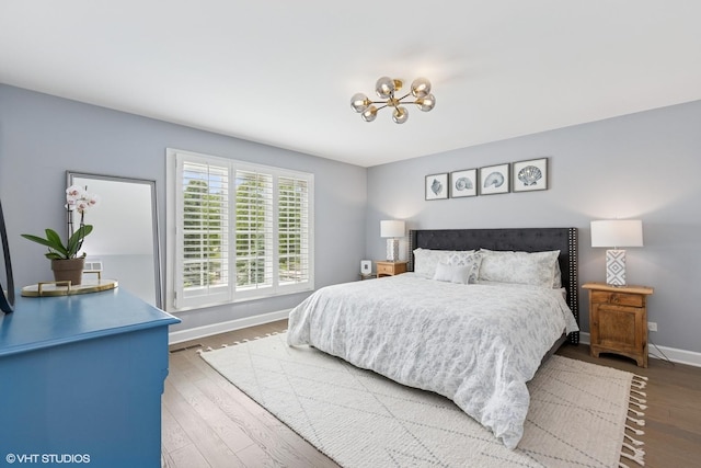 31 E Sandpiper Ln, Lake Forest, IL 60045 - bedroom with a chandelier and wood finished floors