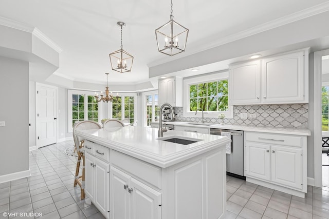 31 E Sandpiper Ln, Lake Forest, IL 60045 - kitchen with stainless steel dishwasher, a chandelier, decorative backsplash, light countertops, and light tile patterned floors