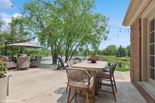 31 E Sandpiper Ln, Lake Forest, IL 60045 - view of patio featuring outdoor dining area, a water view, and an outdoor hangout area