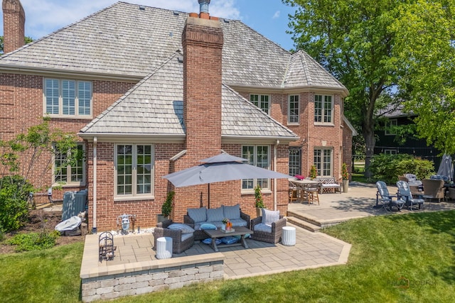 31 E Sandpiper Ln, Lake Forest, IL 60045 - rear view of property featuring a chimney, brick siding, and a patio