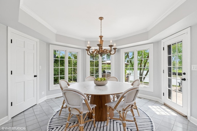 31 E Sandpiper Ln, Lake Forest, IL 60045 - dining space featuring light tile patterned floors, a chandelier, ornamental molding, and a raised ceiling