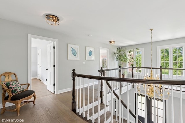 31 E Sandpiper Ln, Lake Forest, IL 60045 - hall featuring a chandelier, an upstairs landing, and wood finished floors