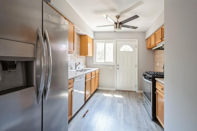 1718 Hovland Ct, Evanston, IL 60201 - kitchen with appliances with stainless steel finishes, ceiling fan, decorative backsplash, and under cabinet range hood