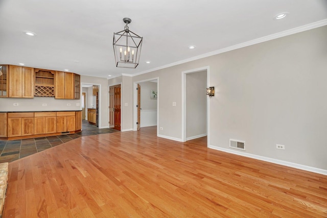 336 Brooklea Ct, Naperville, IL 60565 - unfurnished living room with crown molding, recessed lighting, wood finished floors, and a chandelier