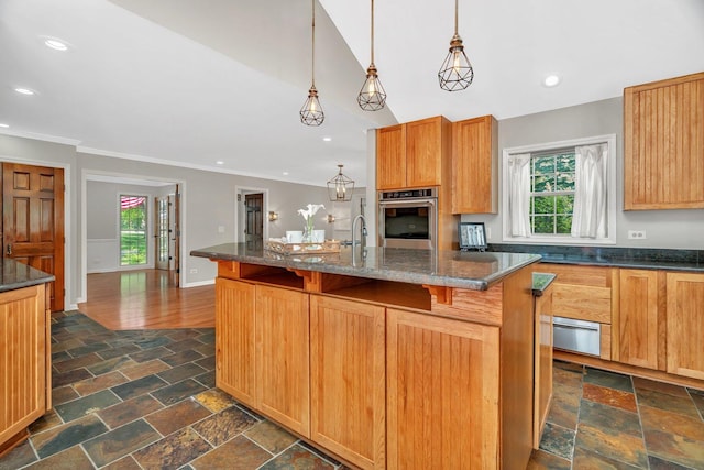 336 Brooklea Ct, Naperville, IL 60565 - kitchen with oven, healthy amount of natural light, stone tile floors, recessed lighting, and a breakfast bar