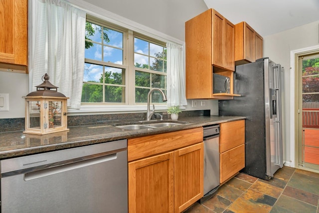 336 Brooklea Ct, Naperville, IL 60565 - kitchen featuring appliances with stainless steel finishes, dark stone finish floors, dark stone countertops, and brown cabinets