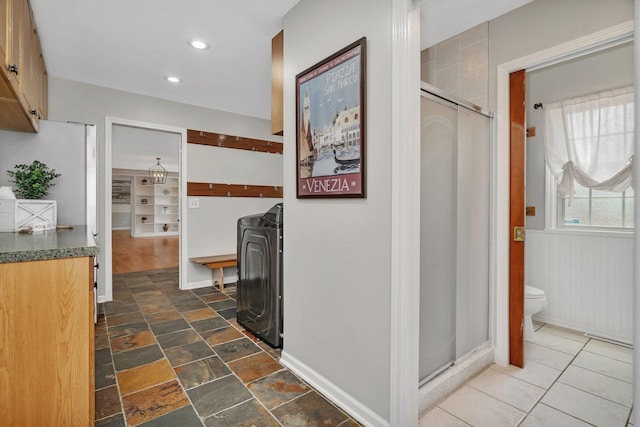 336 Brooklea Ct, Naperville, IL 60565 - corridor featuring washer / clothes dryer, dark stone finish floors, and recessed lighting
