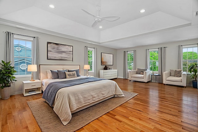 336 Brooklea Ct, Naperville, IL 60565 - bedroom featuring a tray ceiling, light wood-style flooring, recessed lighting, and ceiling fan
