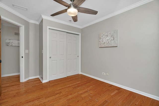 336 Brooklea Ct, Naperville, IL 60565 - unfurnished bedroom with light wood-type flooring, a closet, crown molding, and a ceiling fan