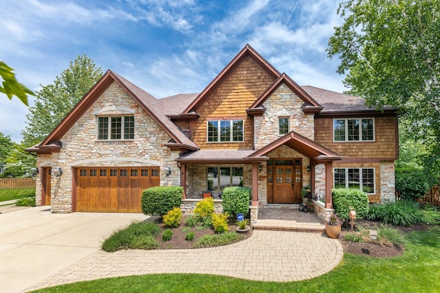 1012 Kennesaw Ct, Naperville, IL 60540 - craftsman house featuring stone siding, driveway, a garage, and roof with shingles