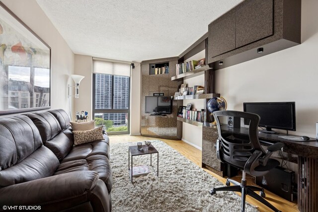 1530 N Dearborn Pkwy Unit 9S, Chicago, IL 60610 - office area with wood finished floors and a textured ceiling