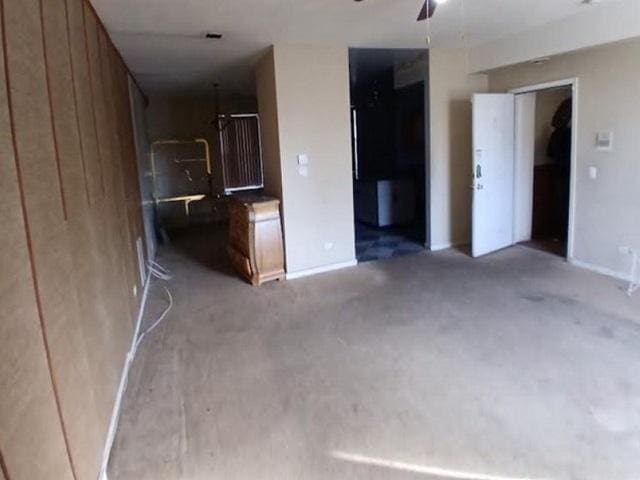 3254 W Flournoy St Unit 1, Chicago, IL 60624 - unfurnished room featuring carpet floors, ceiling fan, and baseboards
