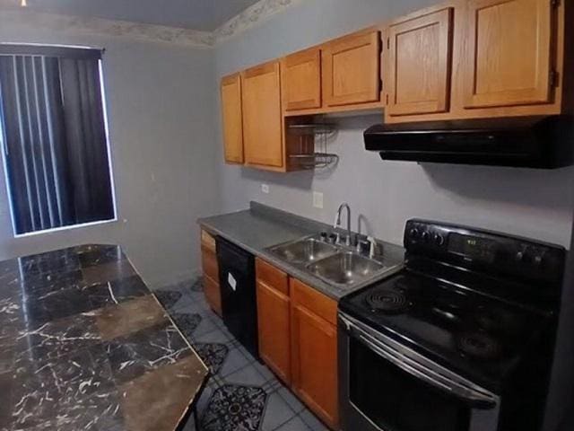 3254 W Flournoy St Unit 1, Chicago, IL 60624 - kitchen with black appliances, exhaust hood, a sink, and dark countertops