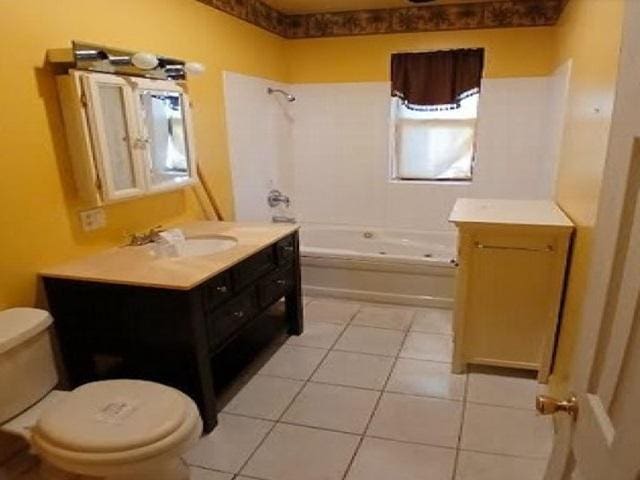3254 W Flournoy St Unit 1, Chicago, IL 60624 - bathroom featuring toilet, vanity, shower / bathtub combination, and tile patterned flooring