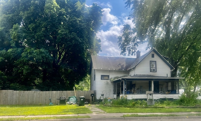 509 W 8th St, Sterling, IL 61081 - view of front facade with a porch and a chimney