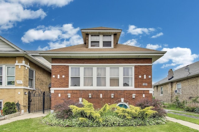 5042 W Wolfram St, Chicago, IL 60641 - view of front facade featuring brick siding and a gate