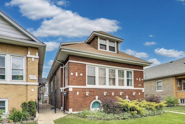 5042 W Wolfram St, Chicago, IL 60641 - view of front of house featuring brick siding and a gate