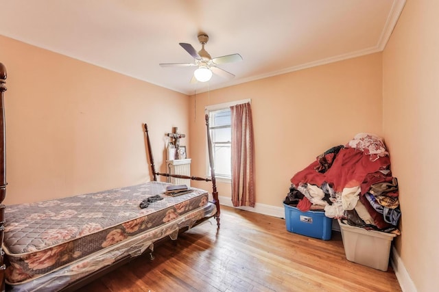 5042 W Wolfram St, Chicago, IL 60641 - bedroom with wood-type flooring, ornamental molding, and ceiling fan