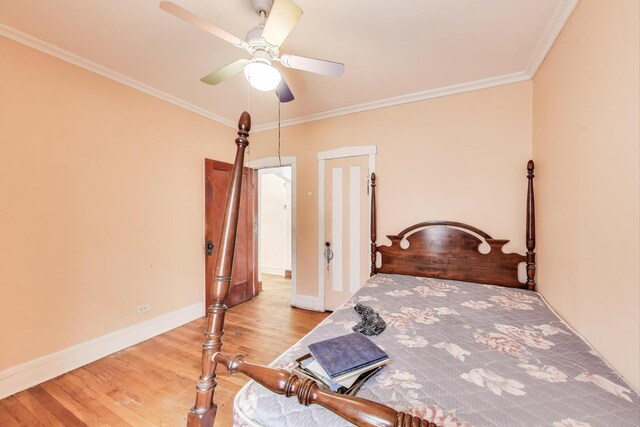 5042 W Wolfram St, Chicago, IL 60641 - bedroom featuring wood finished floors, ornamental molding, and ceiling fan